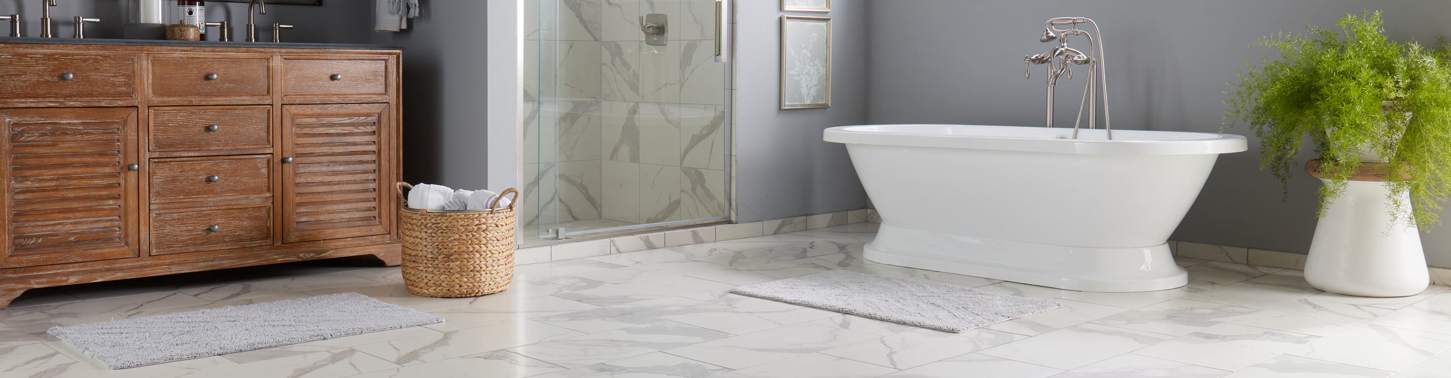 Marble tile bathroom with standing tub.